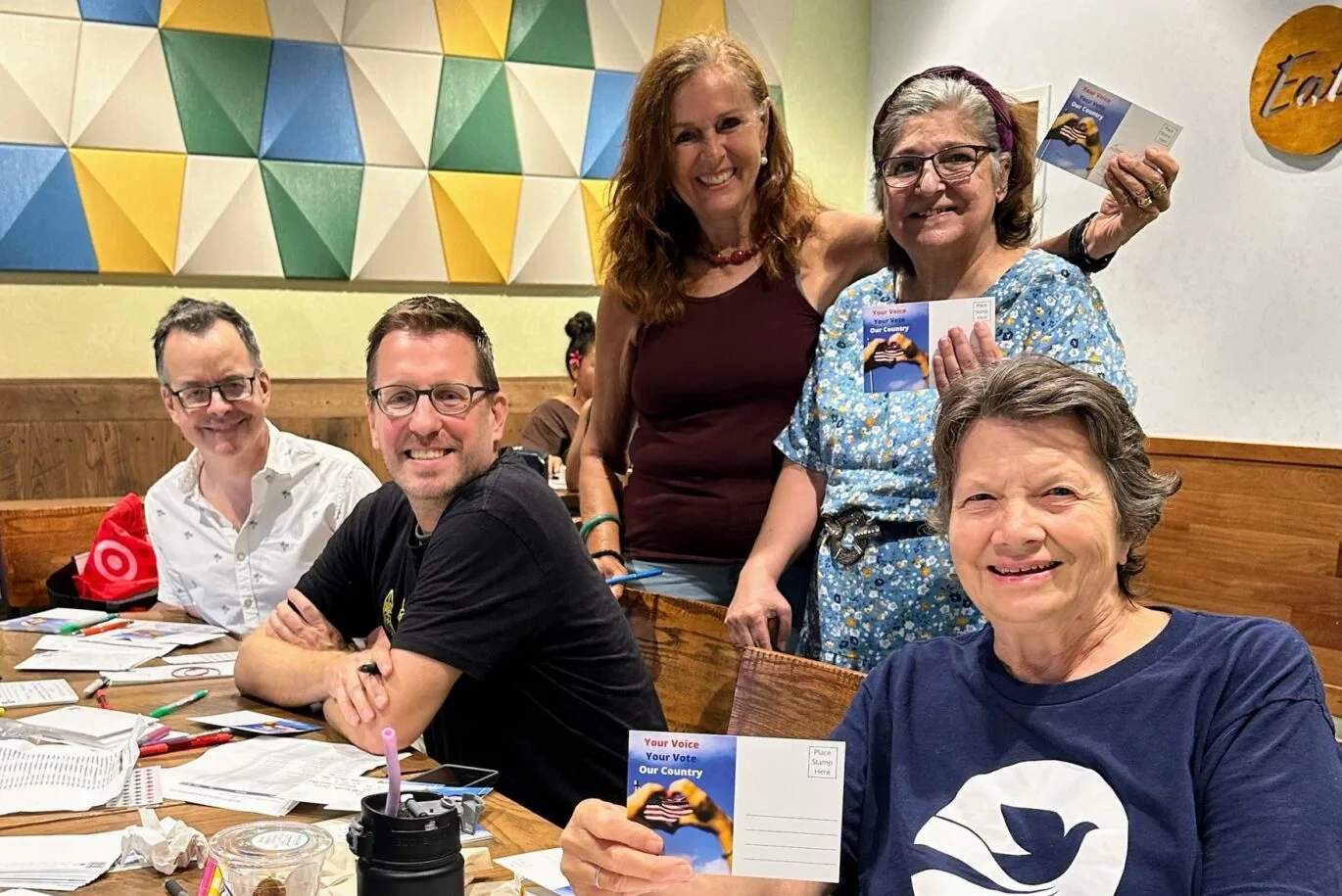 Indivisible Hawaii volunteers at a postcarding get-together